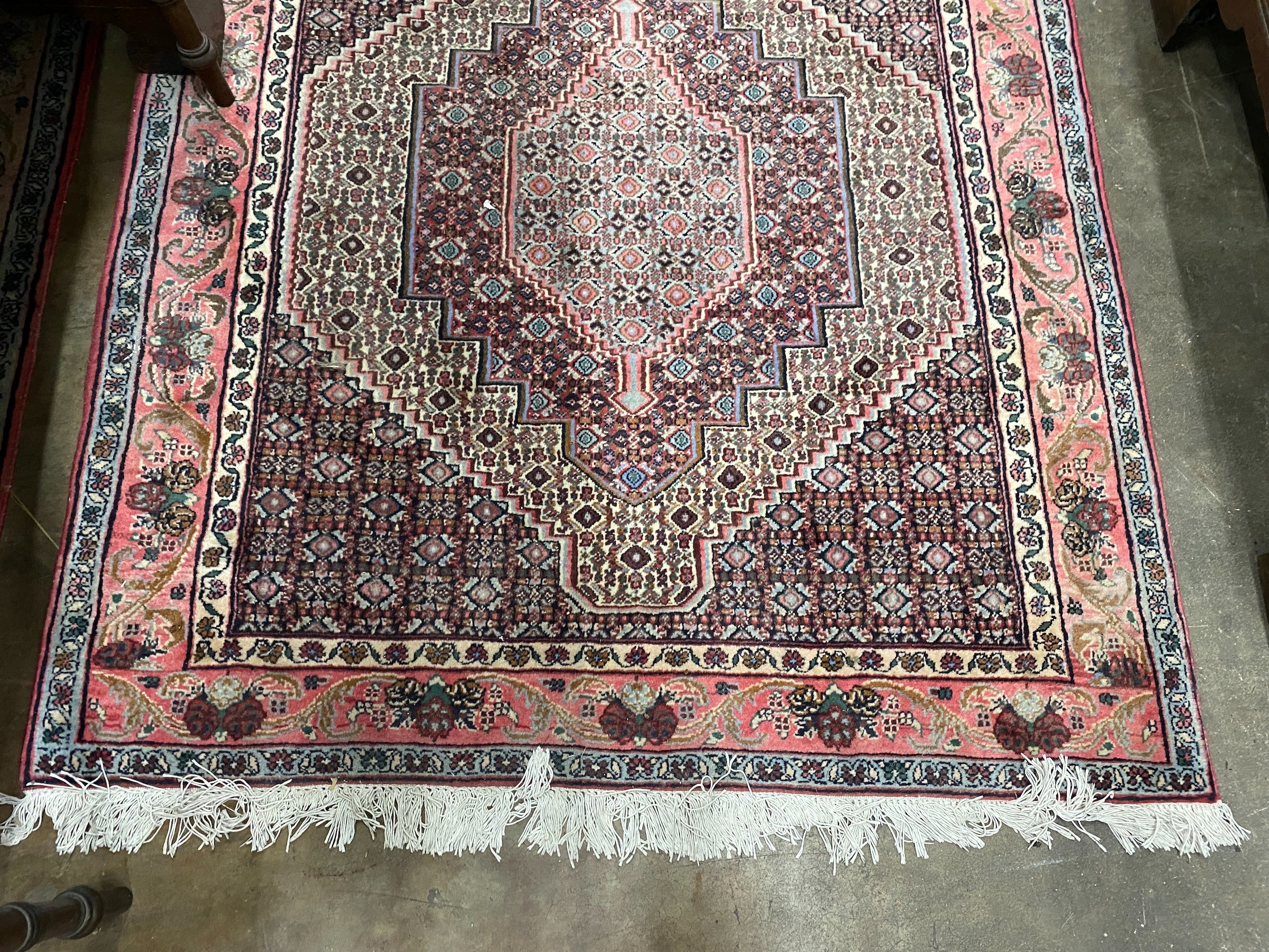 A Senneh blue ground rug, 142 x 122cm